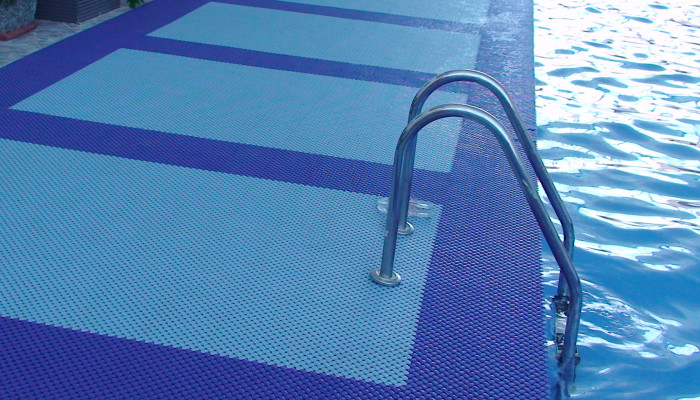 Wet area mats installed around the pool