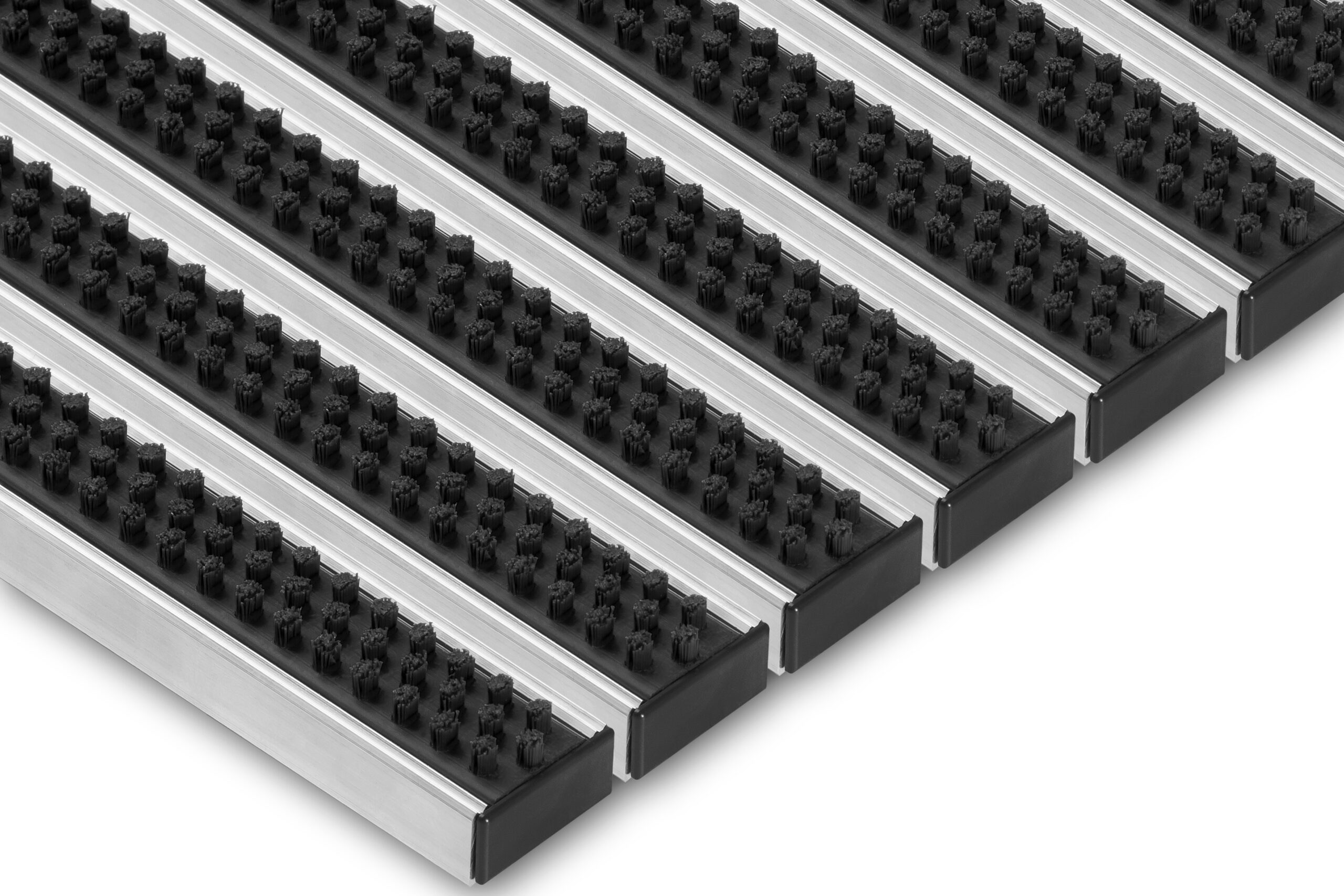 Angled view of Venture Brush entrance grid with black cleaning brushes and aluminium profiles