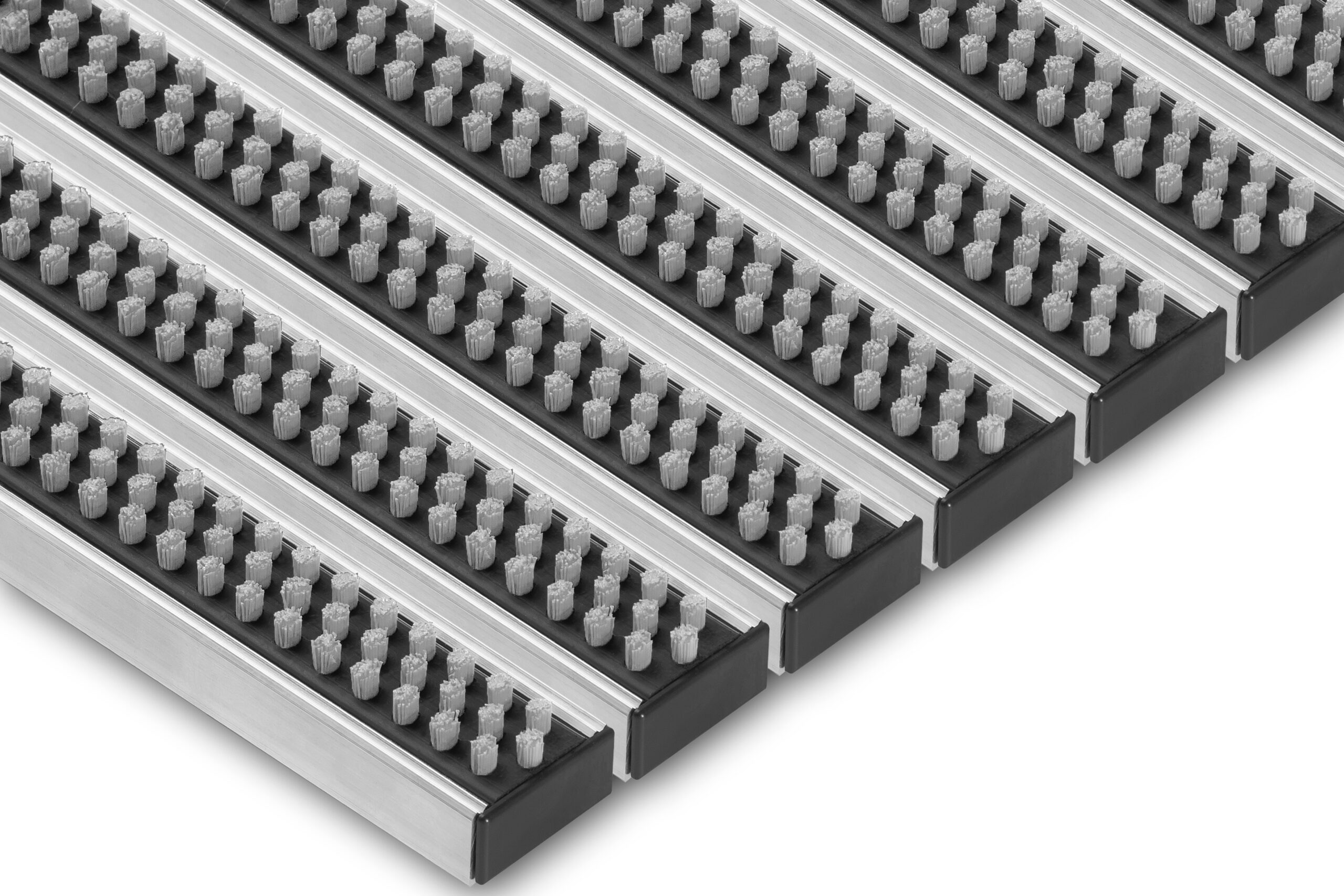Angled view of Venture Brush entrance grid showing grey cleaning brushes and aluminium profile construction